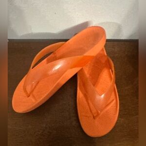 Crocs Women's Splash Glossy Flip Flops in the color Persimmon Orange size 9